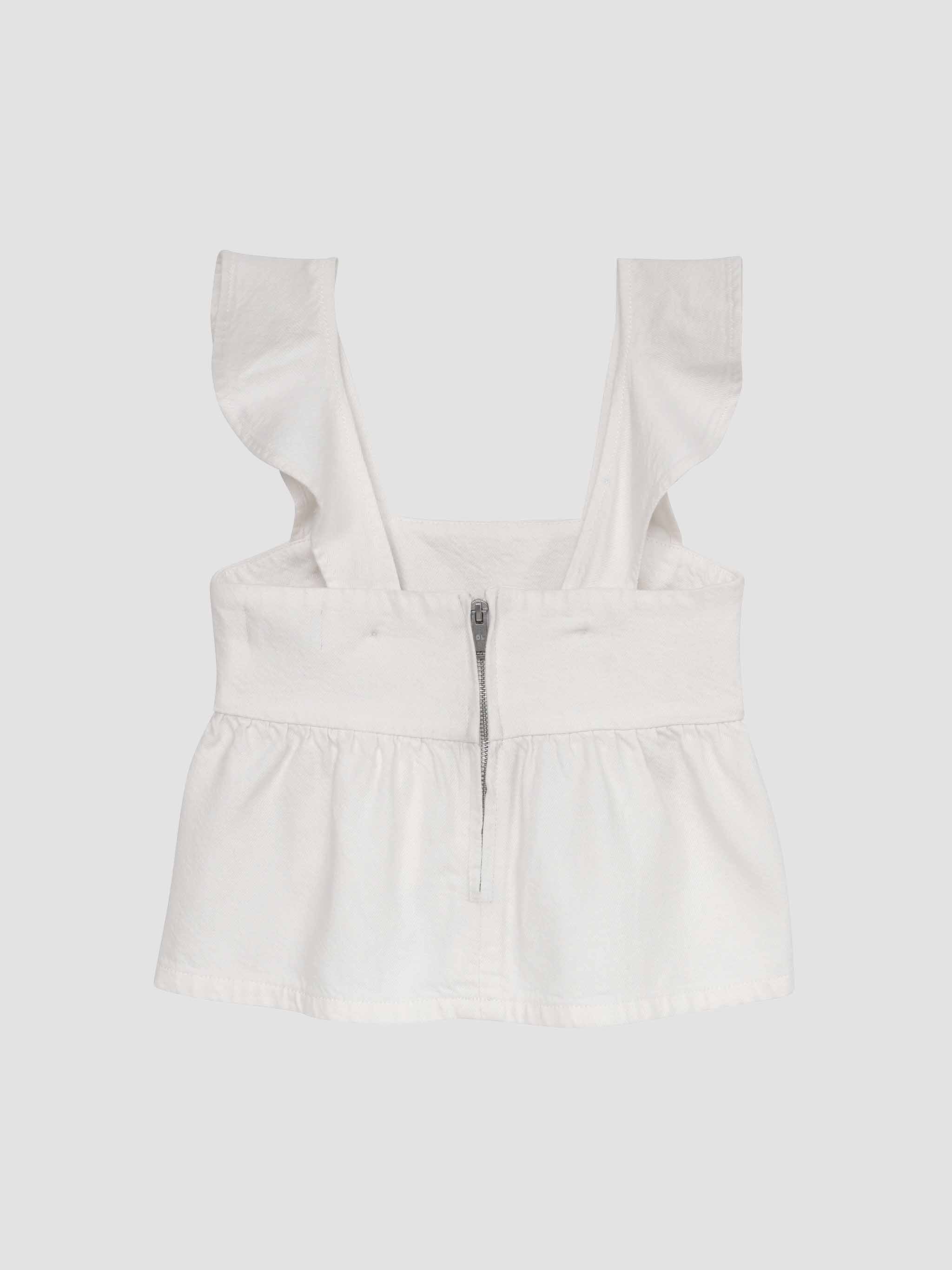 White strapless top with ruffled straps on a light gray background