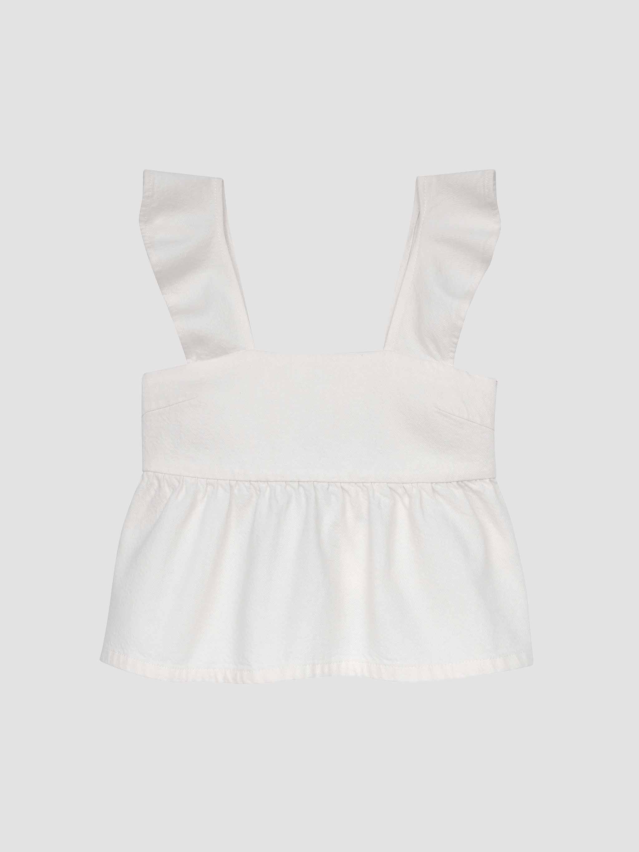 White strapless top with ruffled straps on a light gray background