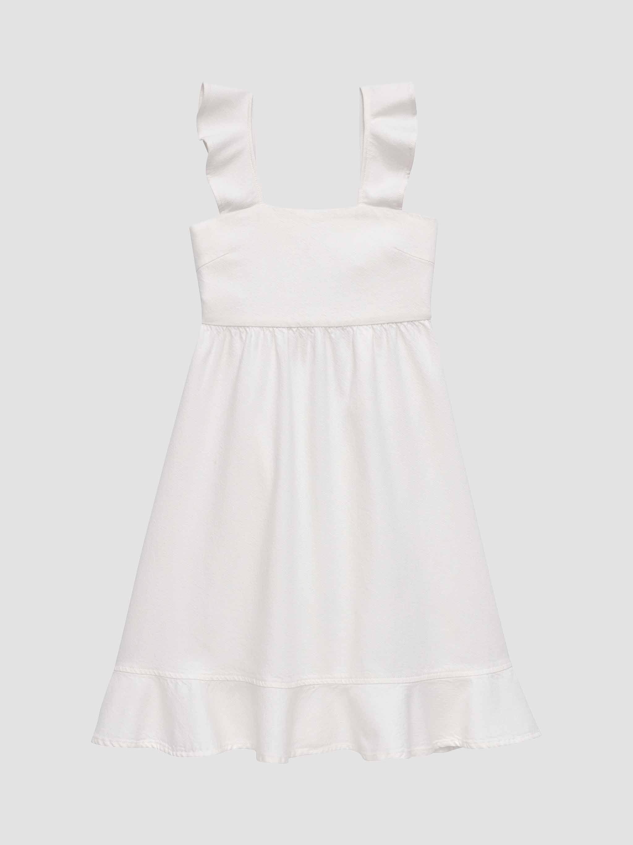 White dress with bow straps on a light gray background