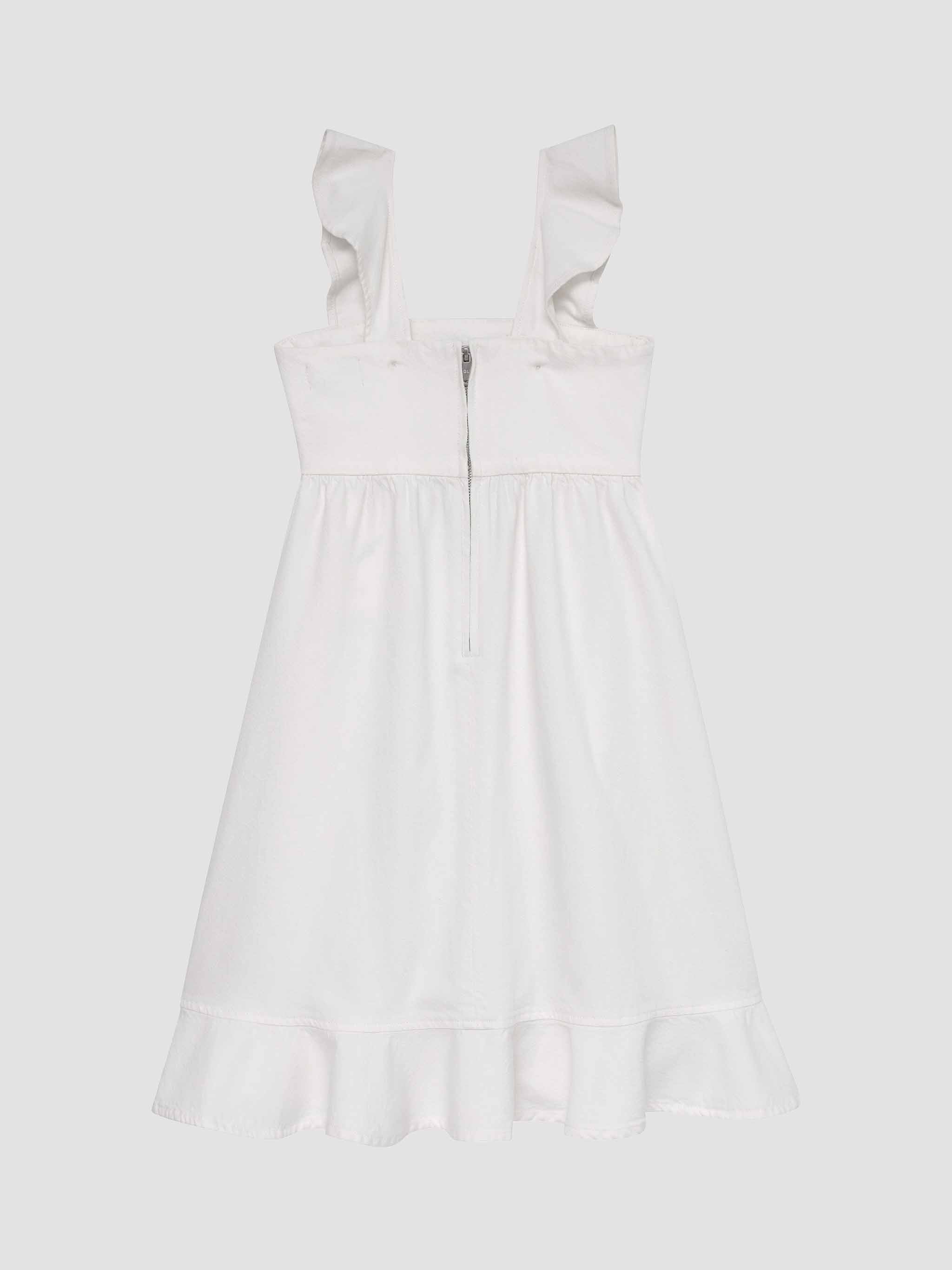 White dress with ruffled straps on a light gray background