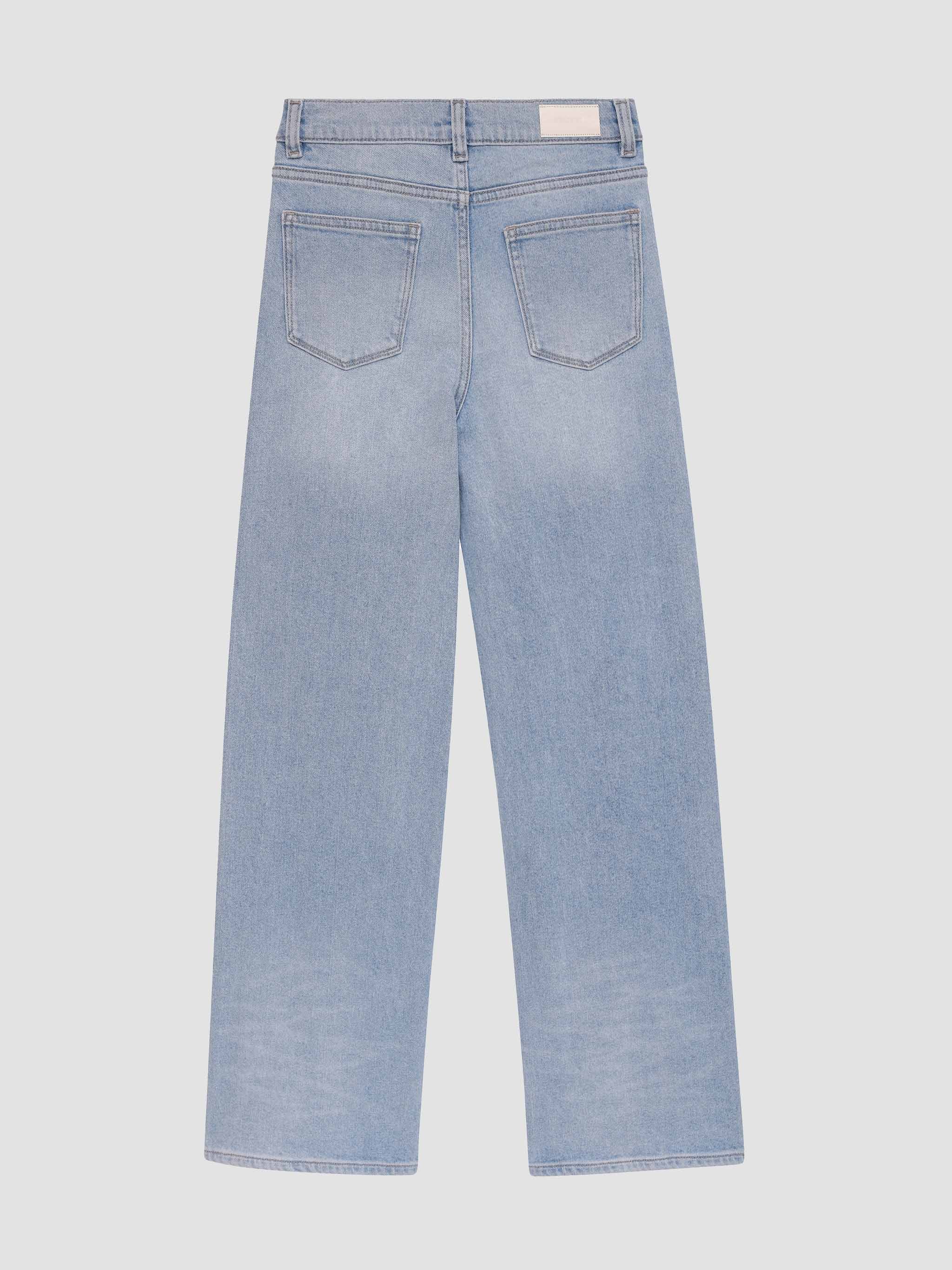 Light blue jeans on a light gray background