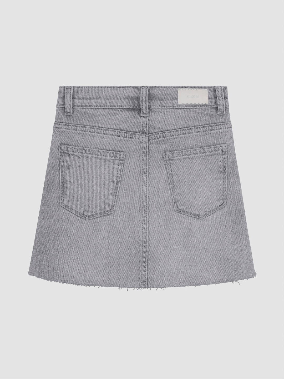 DL1961 girls' Jenny mini skirt in light grey 'Moonlight Mist', flat back view with five-pocket styling and frayed hem.