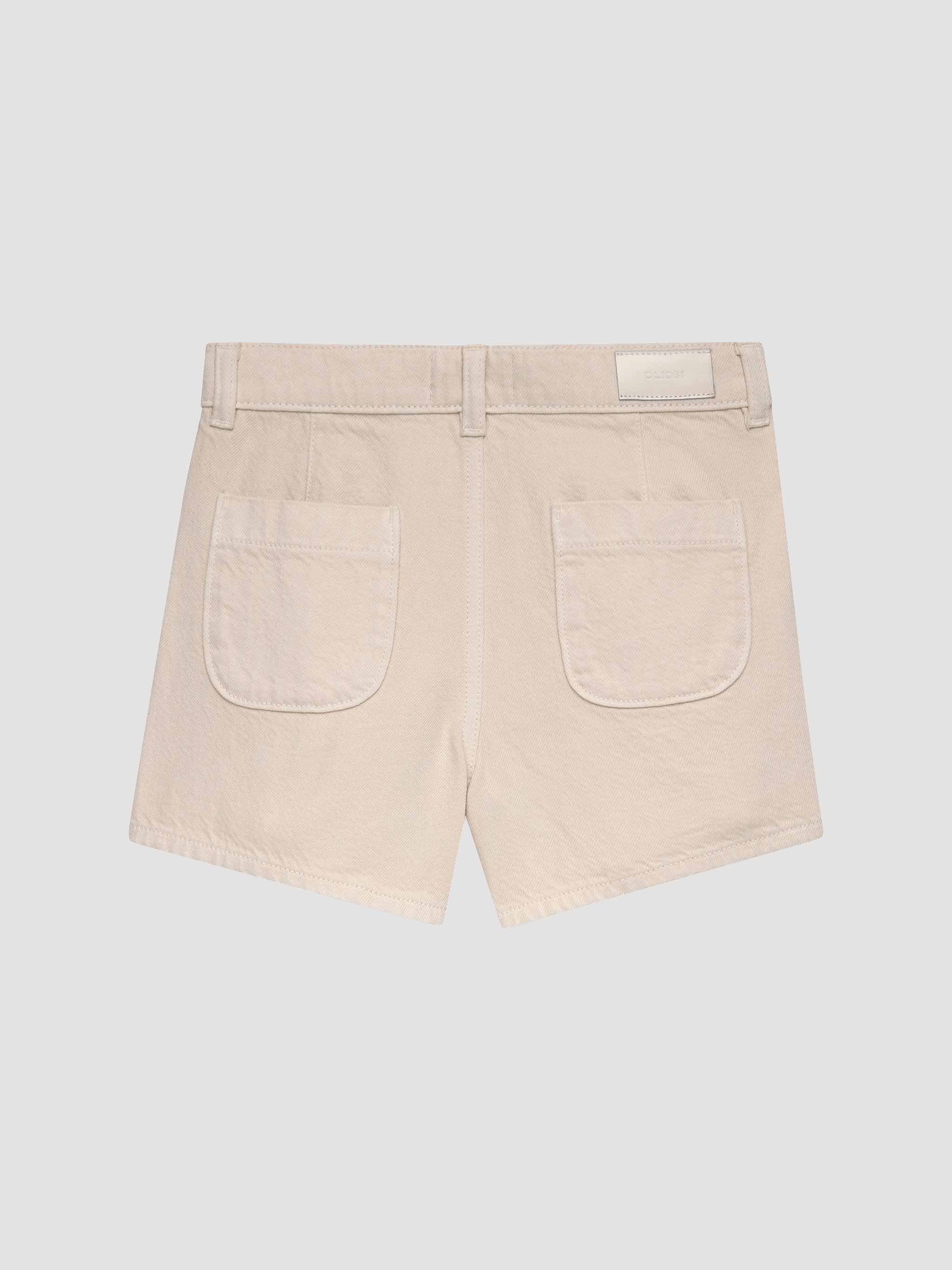 Beige shorts on a light gray background