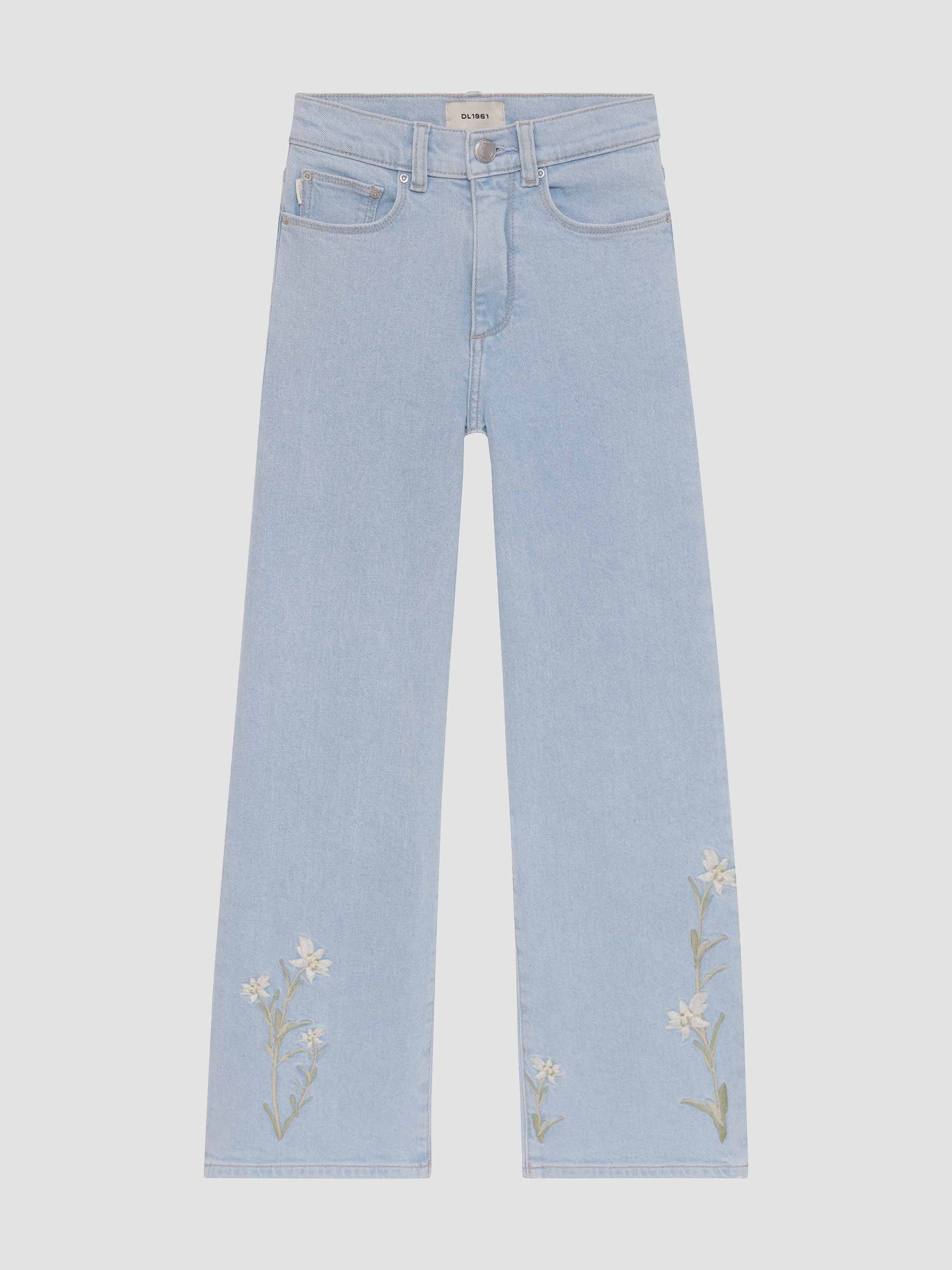 Light blue jeans with floral embroidery on a white background