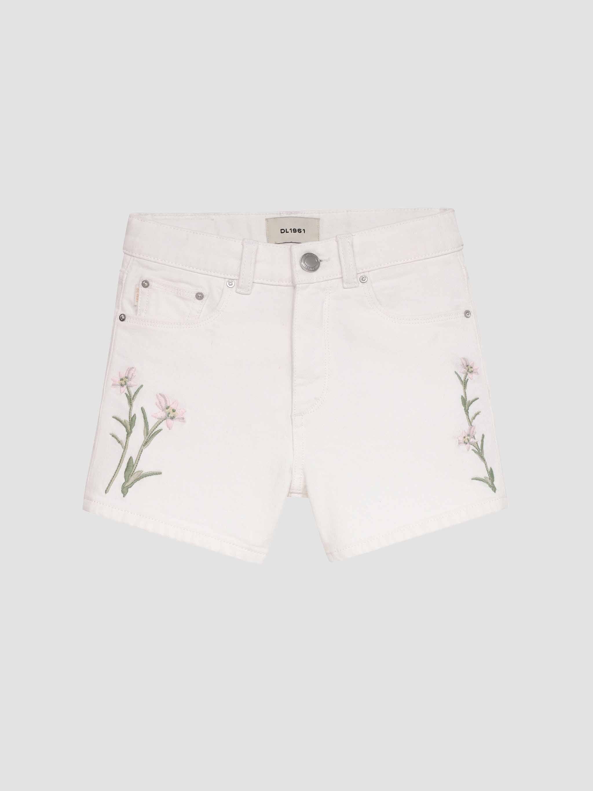 White shorts with floral embroidery on a light gray background