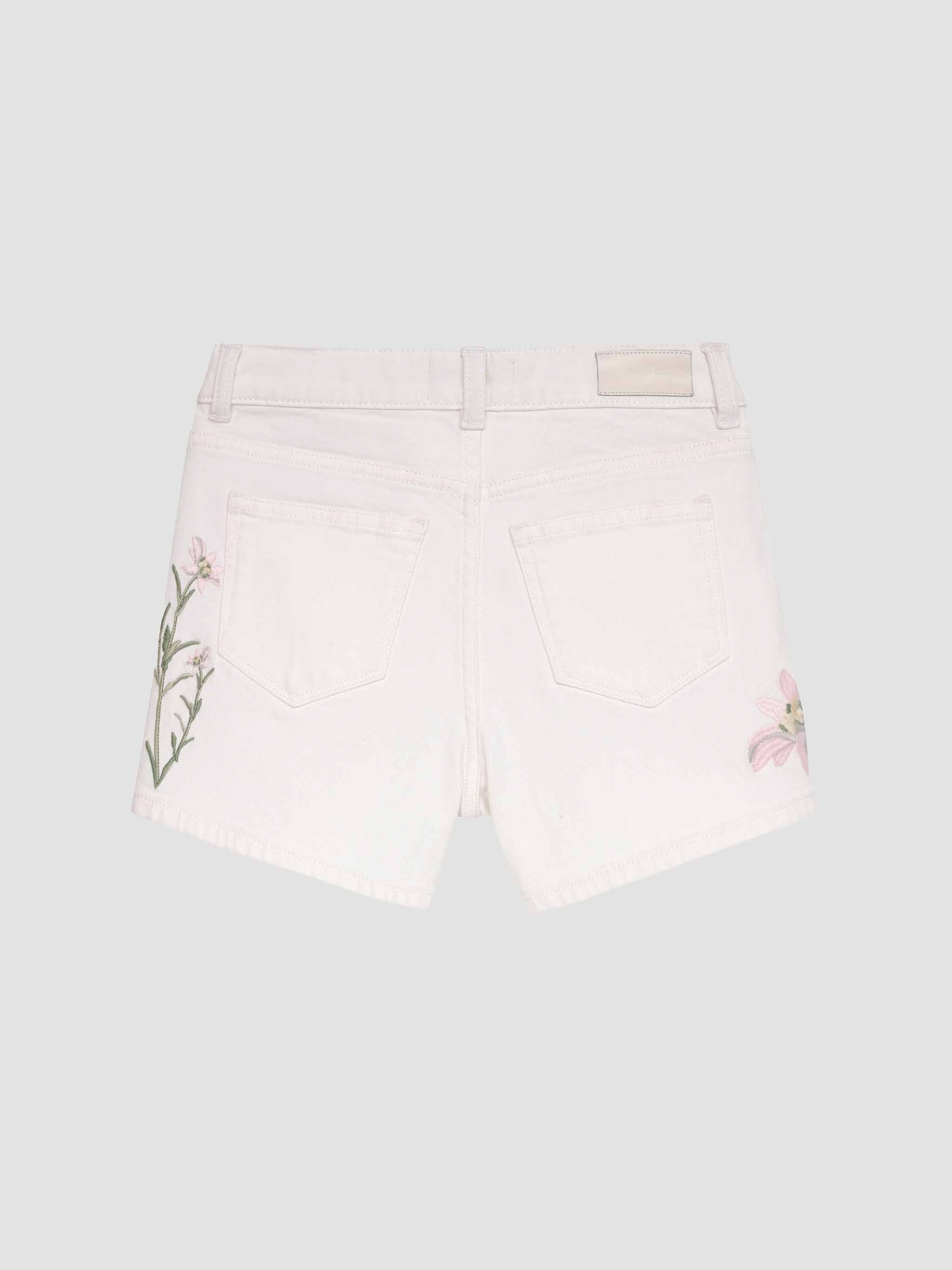 White shorts with floral embroidery on a light gray background