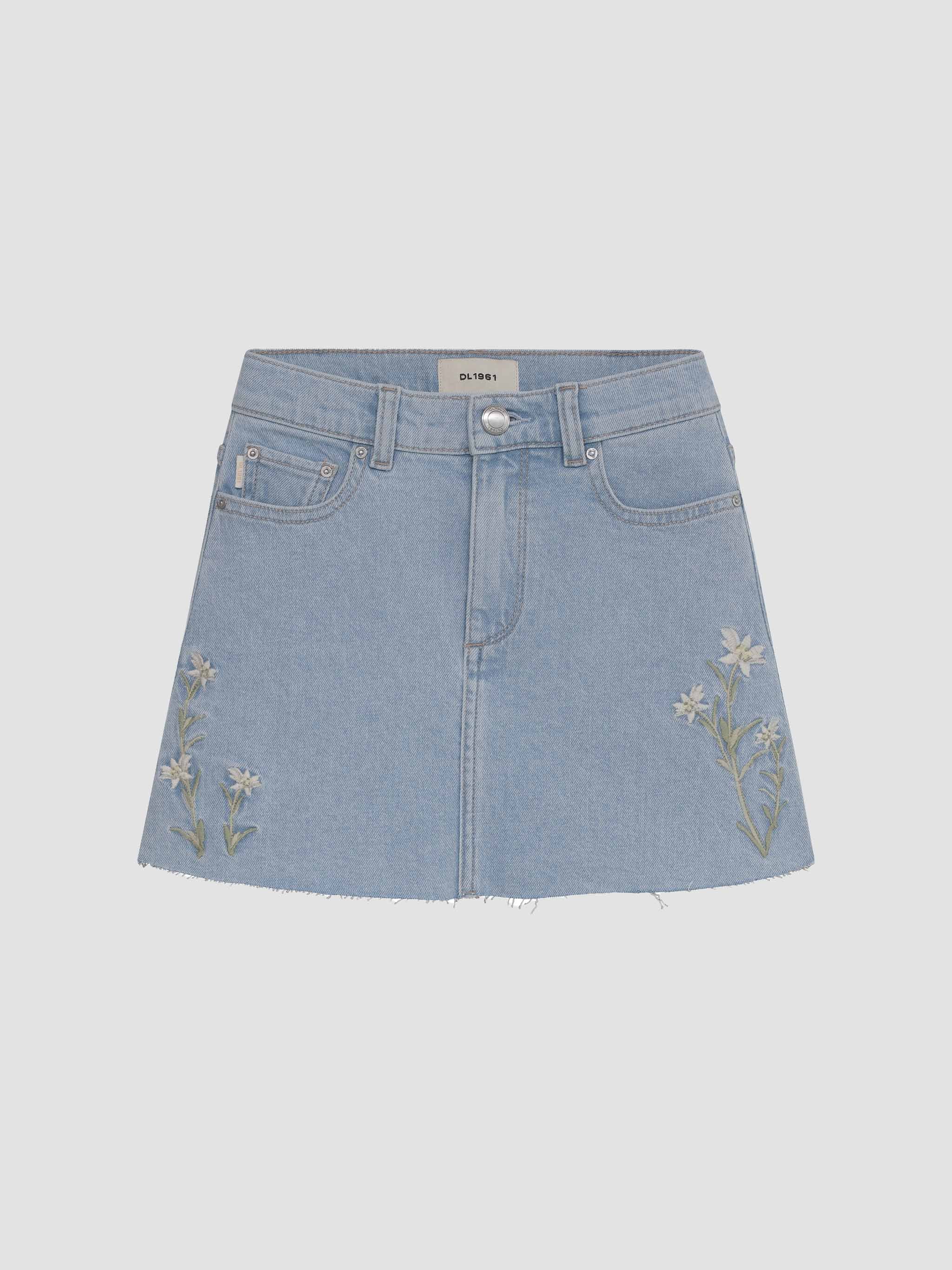Light blue denim skirt with floral embroidery on a light gray background