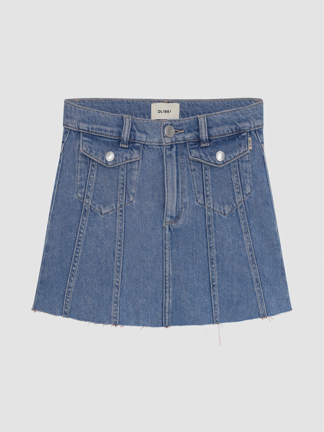 DL1961 girls' Jenny mini skirt in medium blue 'Indigo Rose', flat front view with paneling and flap pockets.