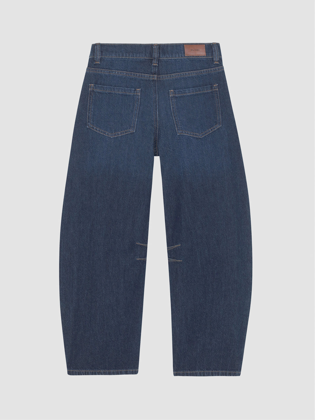 DL1961 girls' Lilia barrel jeans in dark indigo 'Deep Water', flat back view with leather waist patch.