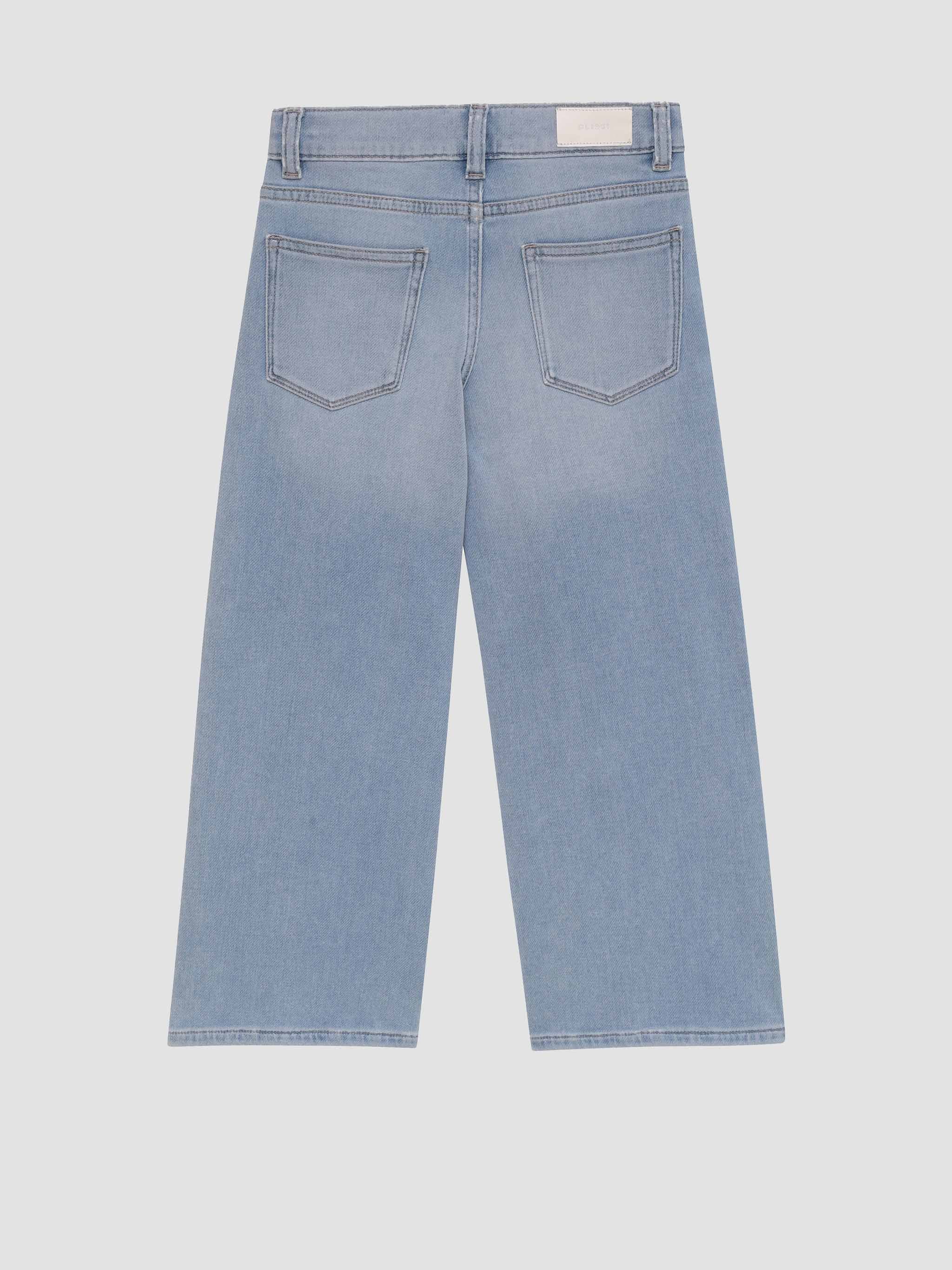 Light blue jeans on a light gray background