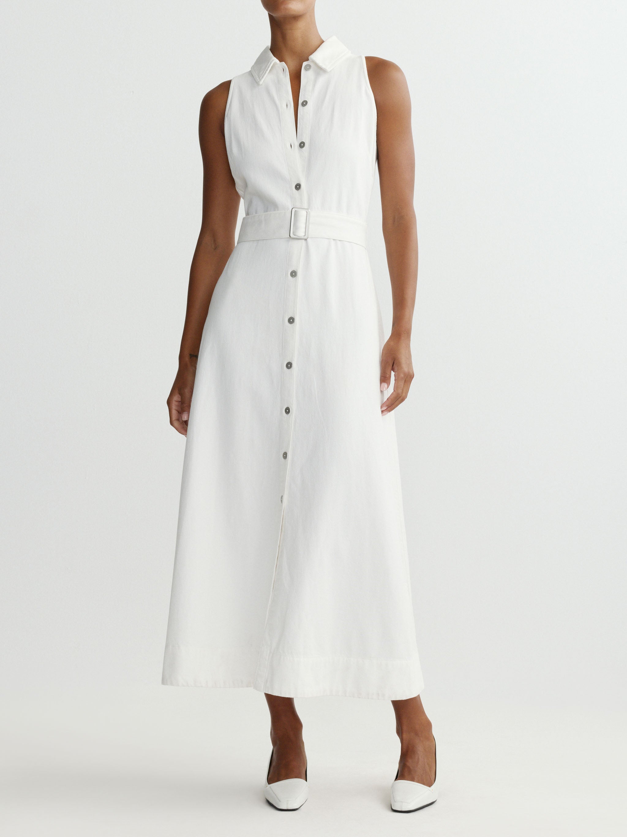 White sleeveless dress worn by a model on a white background