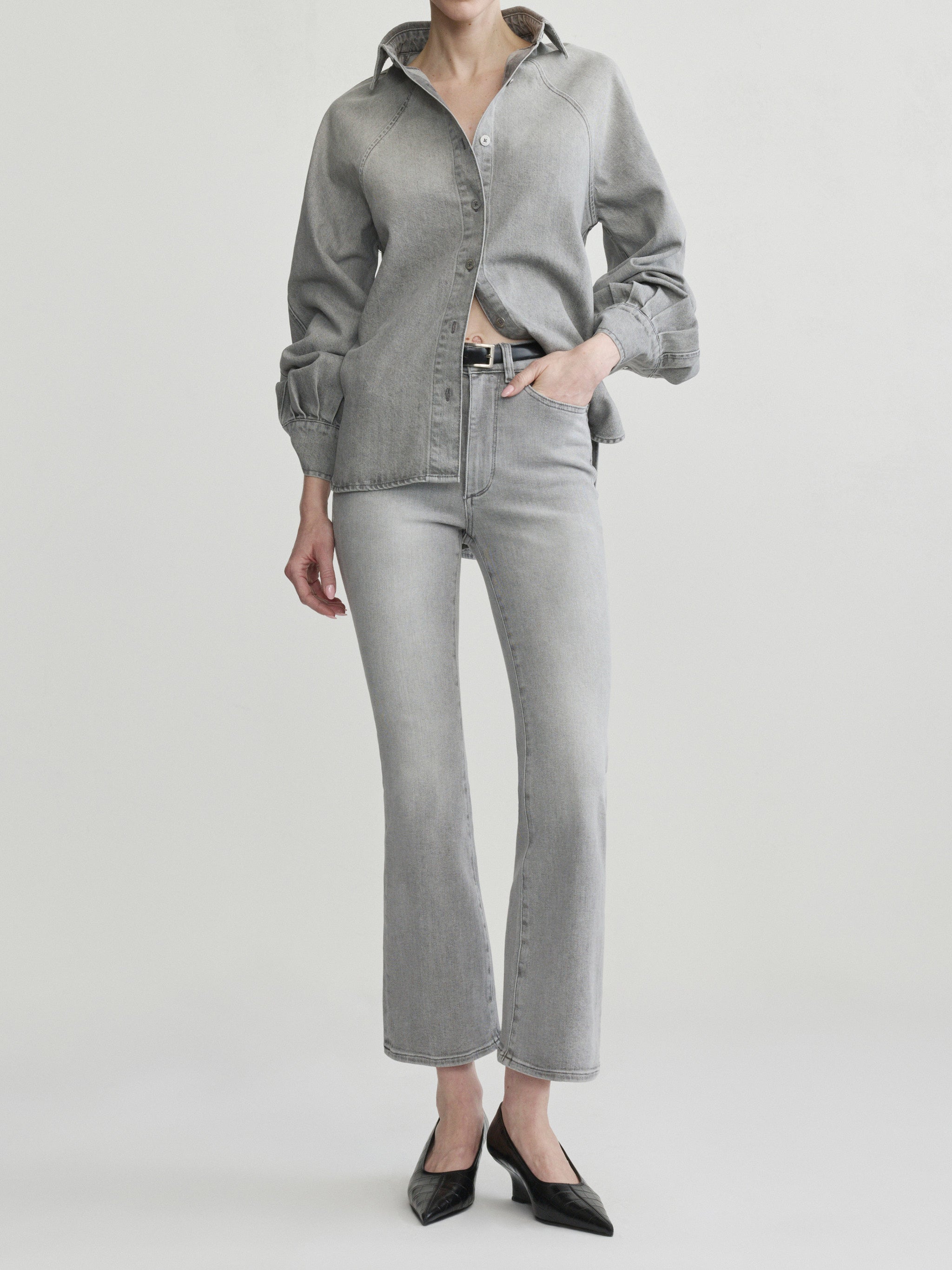 Mika Shirt in Light Smoke on a model with grey jeans, studio full-length front view.