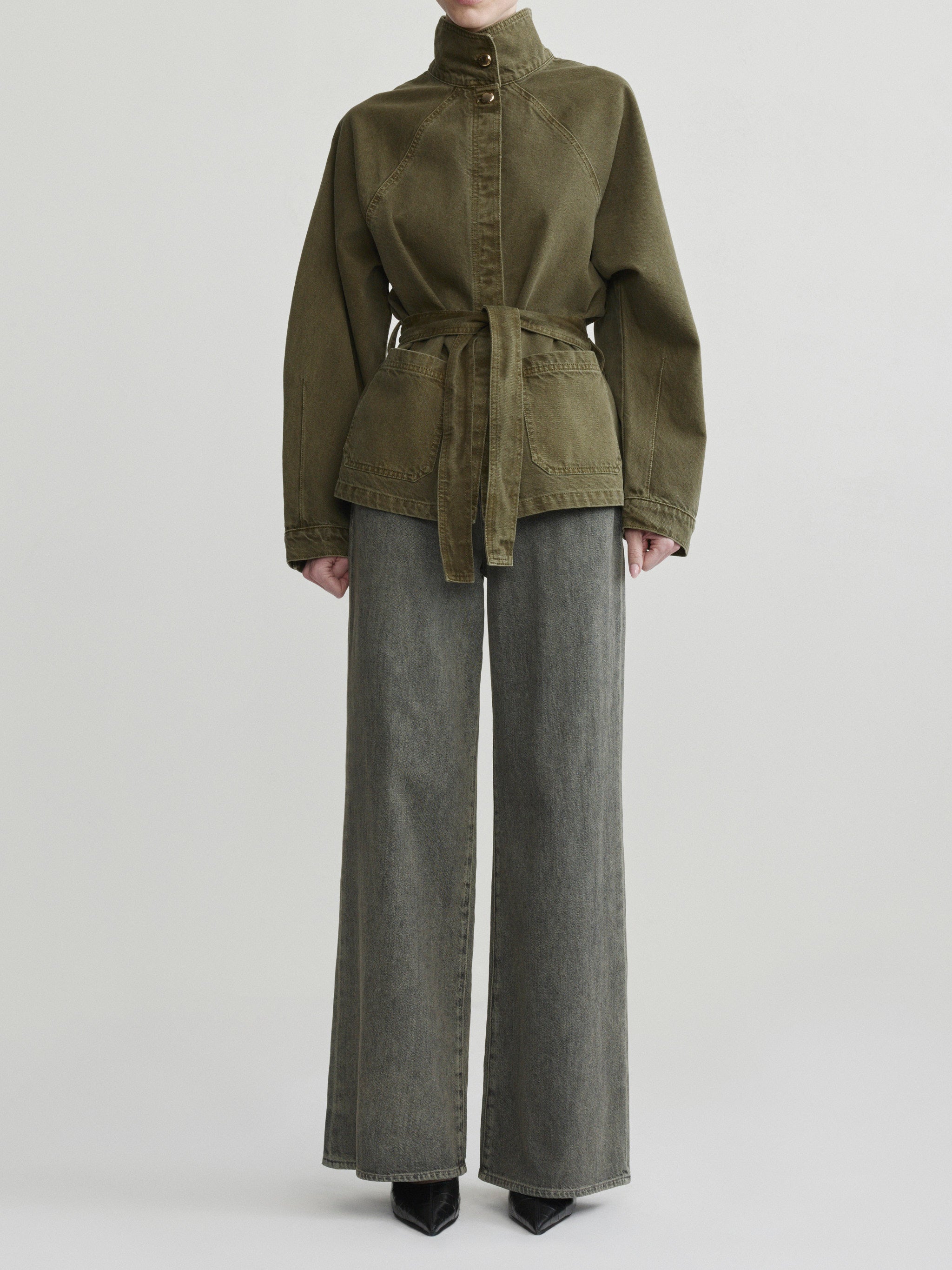 Shiloh Jacket in Pine on a model with grey wide-leg jeans, studio full-length front view.