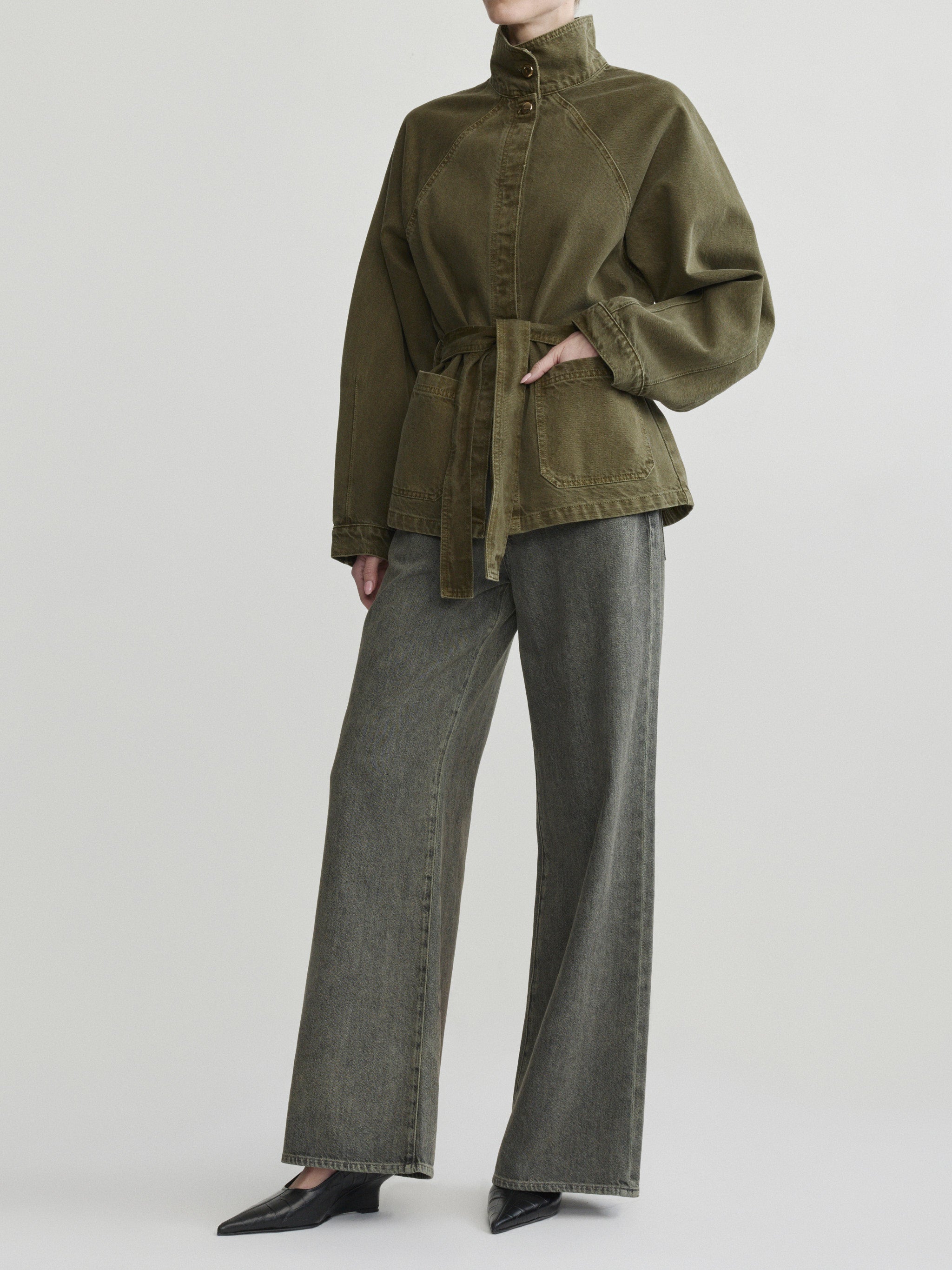 Shiloh Jacket in Pine on a model with grey wide-leg jeans, studio full-length three-quarter view.