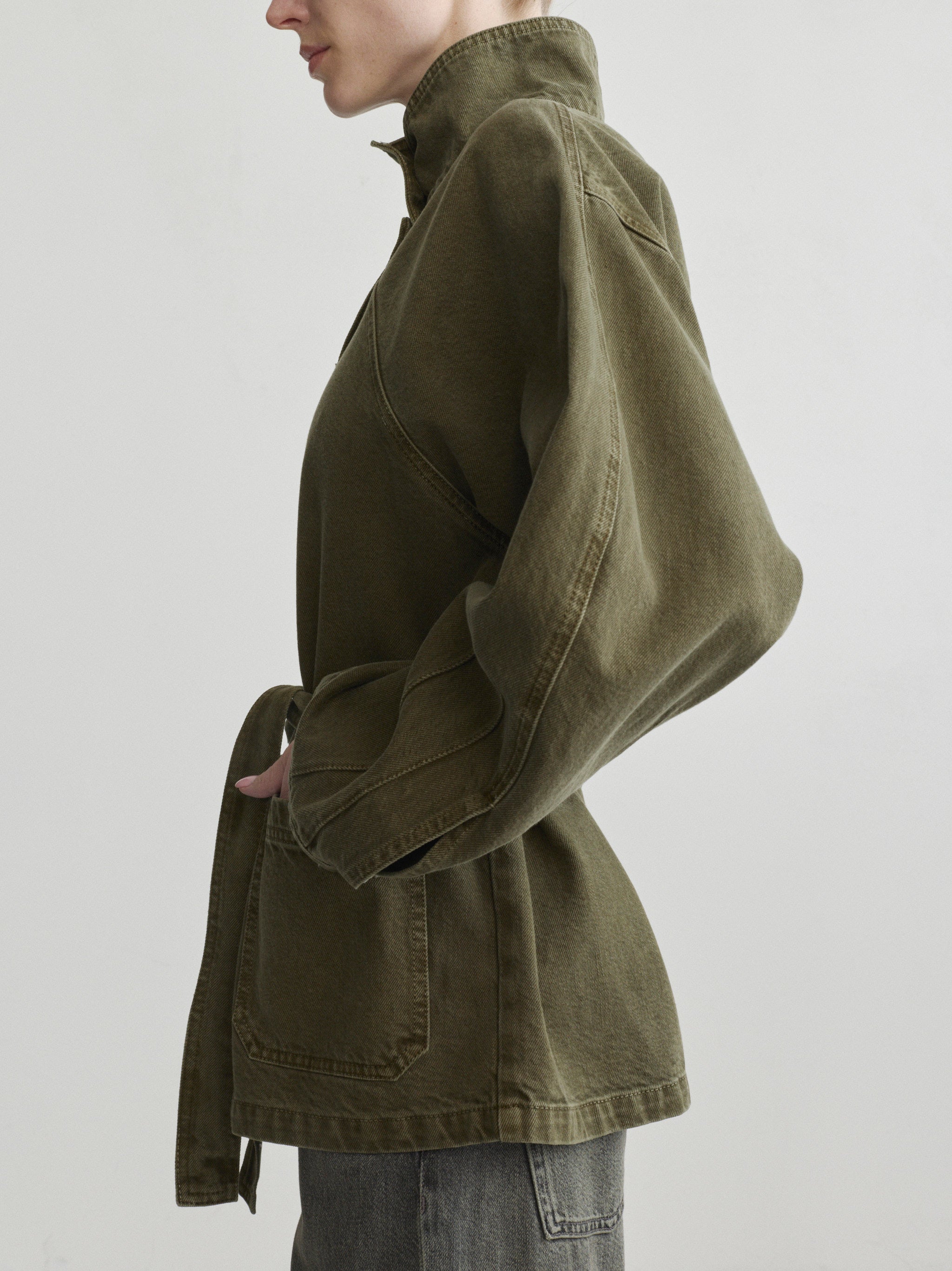 Shiloh Jacket in Pine on a model, studio side close-up of the jacket sleeve and pocket.