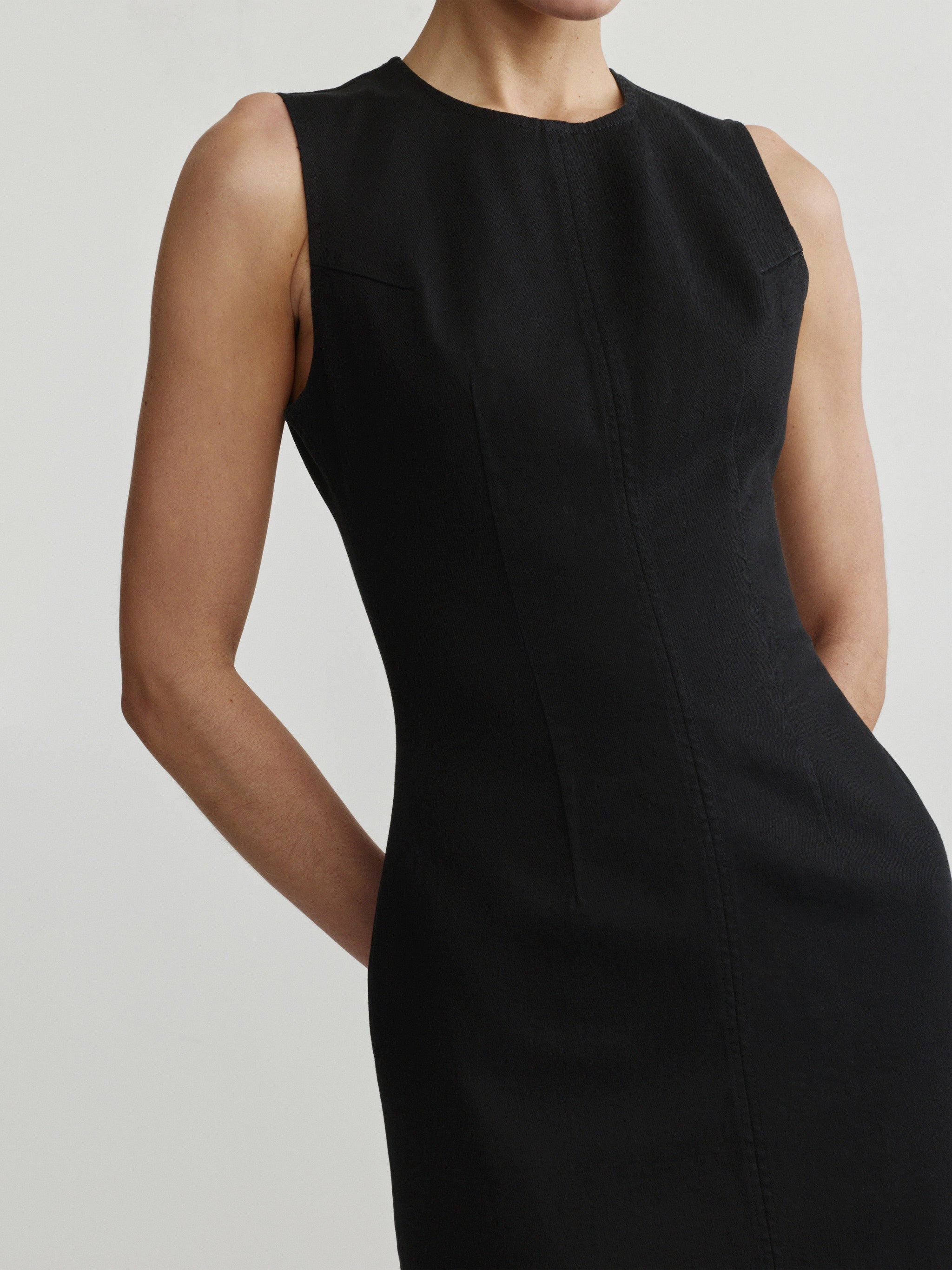 Esme Dress in Black on a model, studio close-up of the bodice and seam detail.