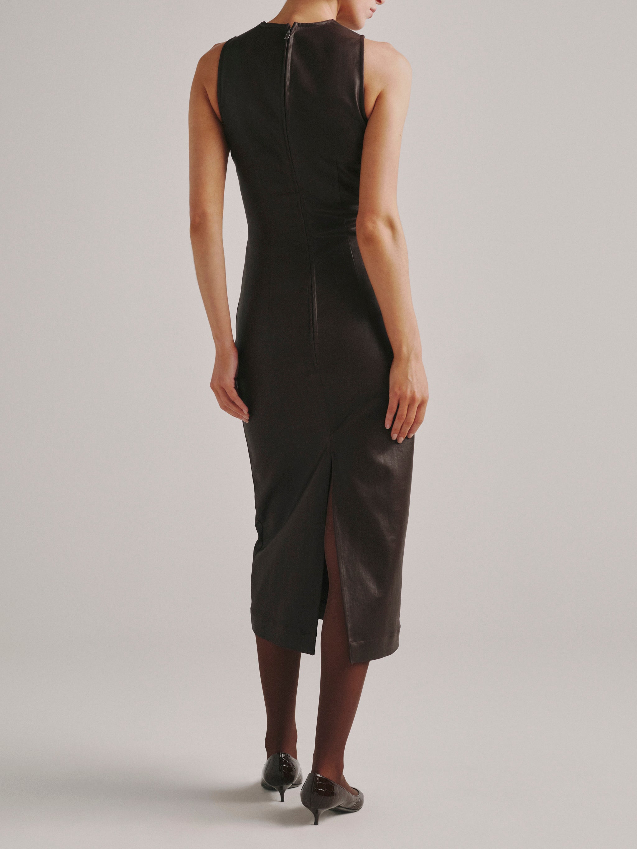 DL1961 Esme Midi Denim Dress in dark berry coated denim, sleeveless midi with back zip and slit, back view.