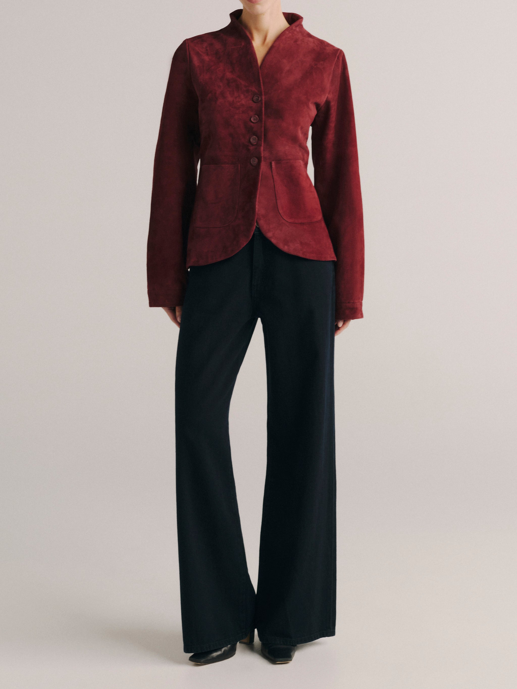 DL1961 women's Telluride suede jacket in 'Burgundy Suede Embroidery', full-length front view with black wide leg pants.