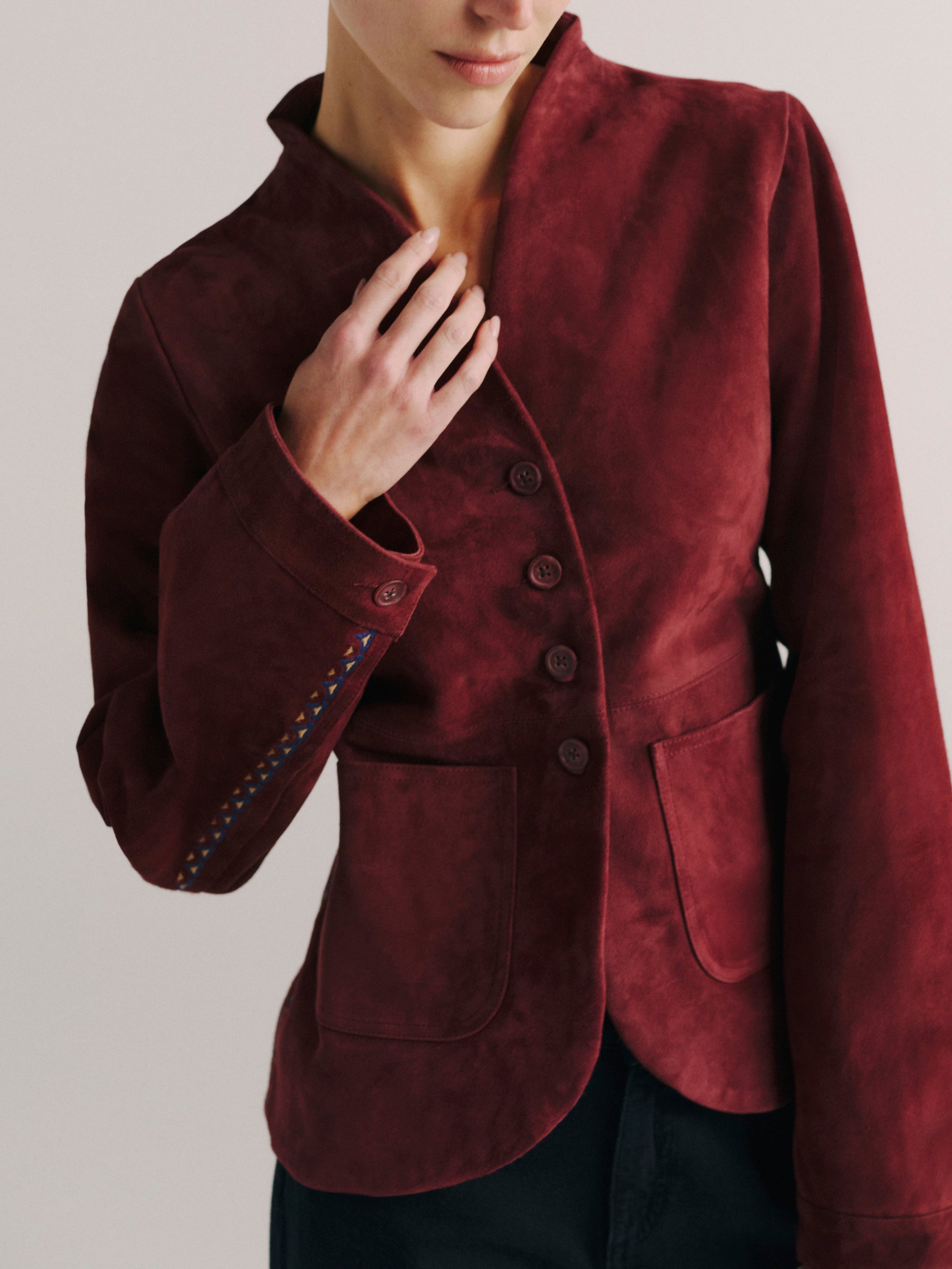 DL1961 women's Telluride suede jacket in 'Burgundy Suede Embroidery', front view showing the button front and patch pockets.