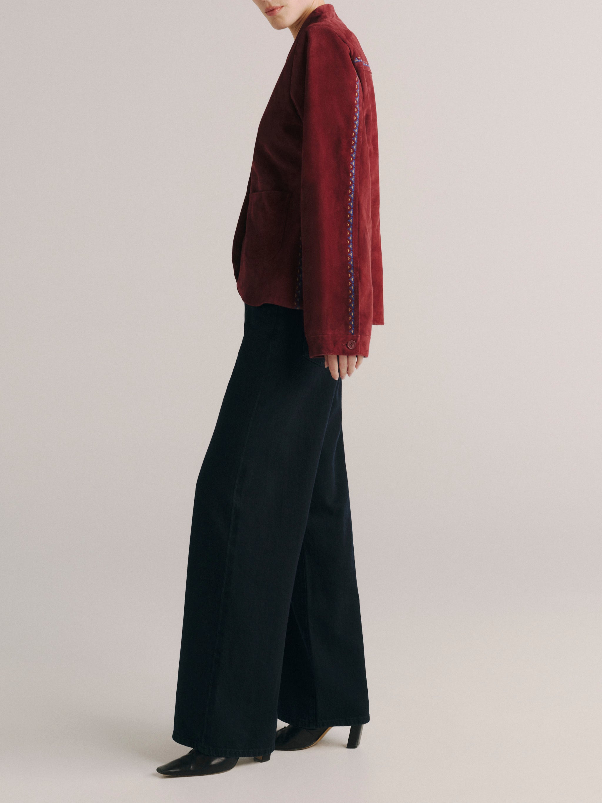 DL1961 women's Telluride suede jacket in 'Burgundy Suede Embroidery', side view showing the fitted silhouette.