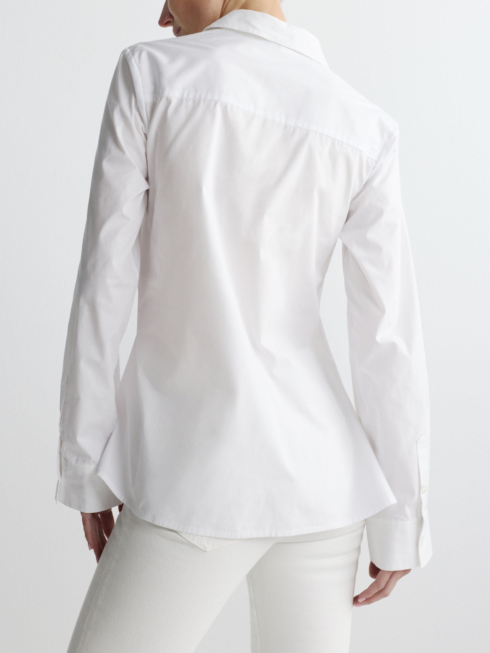 White shirt worn by a person on a white background