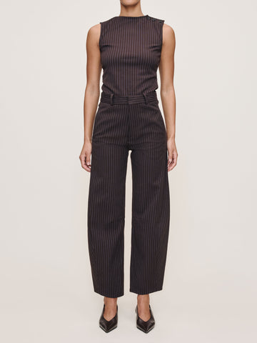Black pinstripe jumpsuit worn by a model on a white background