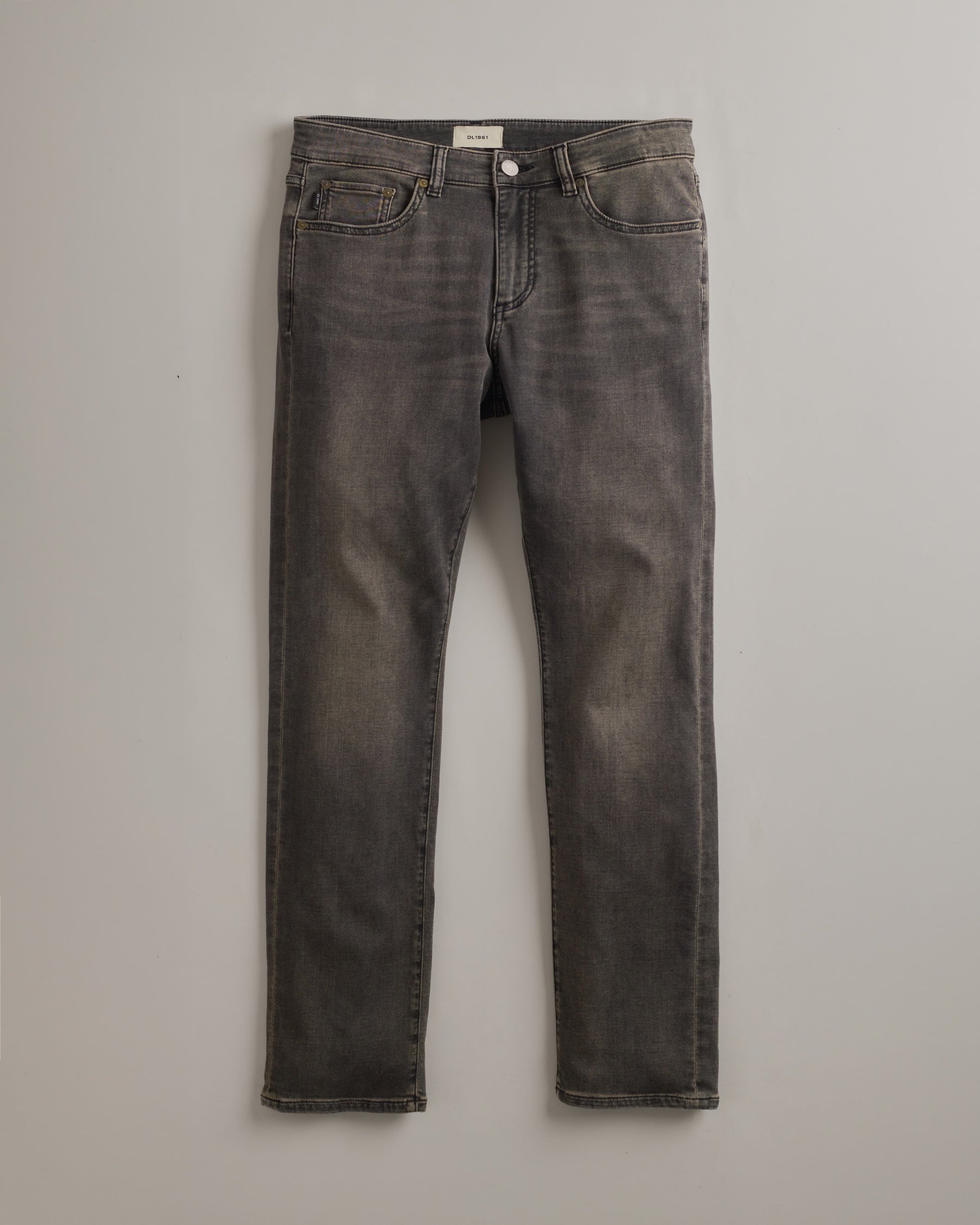 DL1961 men's Nick Slim Jeans in 'Rock' — studio flat lay packshot on a plain background, no model.
