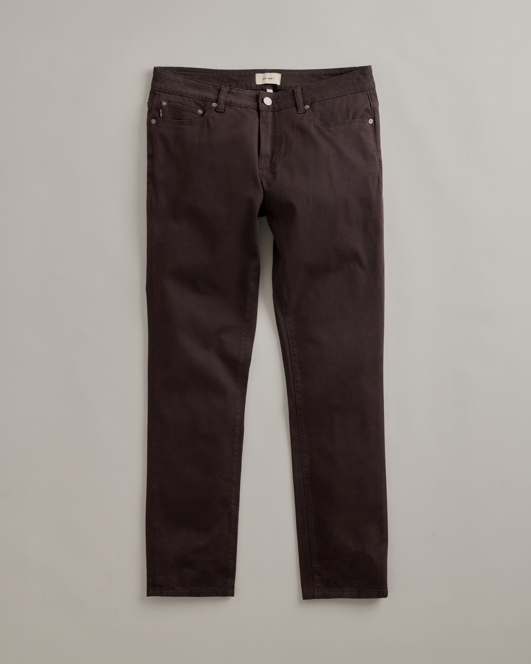 DL1961 men's Nick Slim Pants in 'Lacquer' — studio flat lay packshot on a plain background, no model.