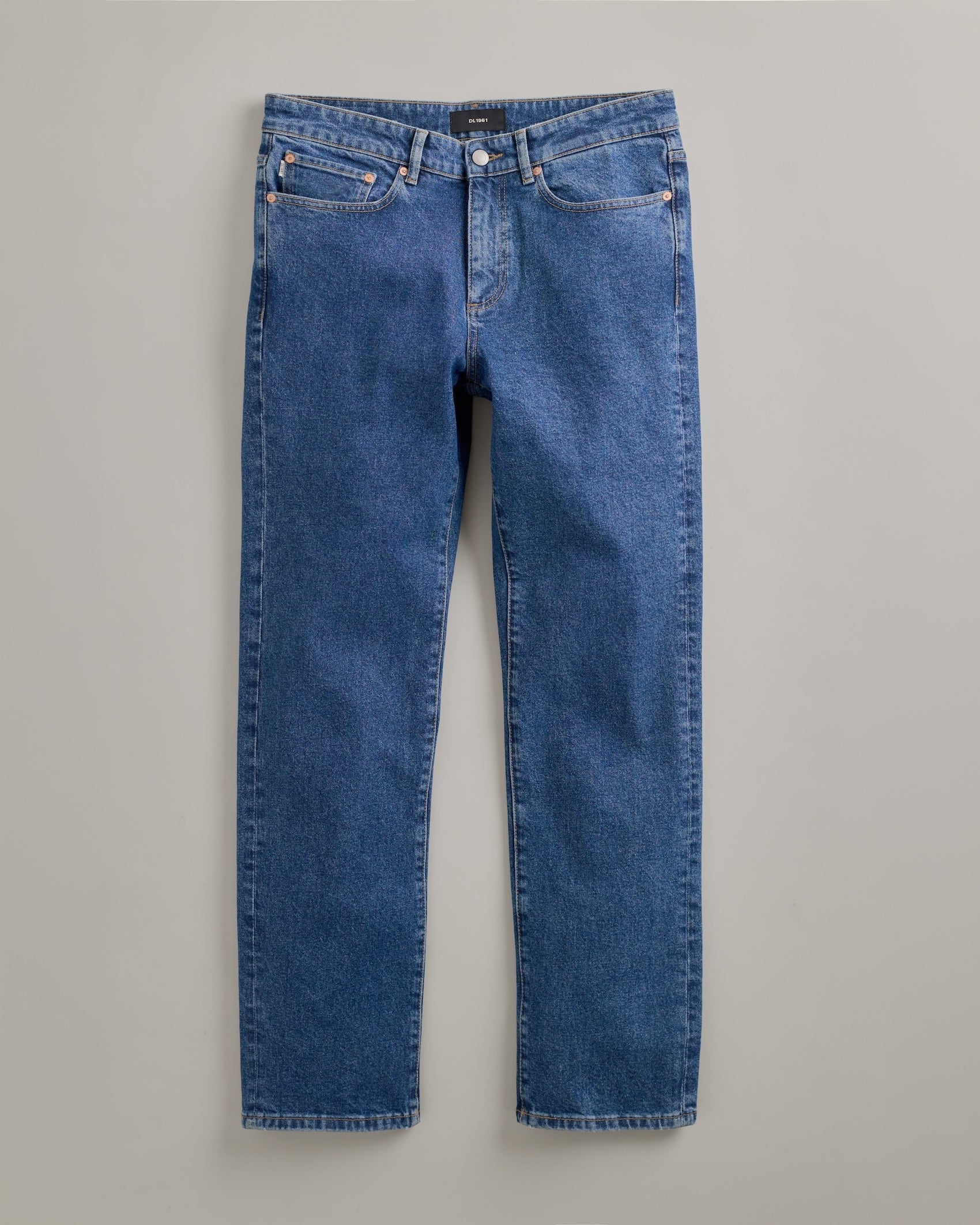 DL1961 men's Nick Slim Jeans in 'North Beach' — studio flat lay packshot on a plain background, no model.