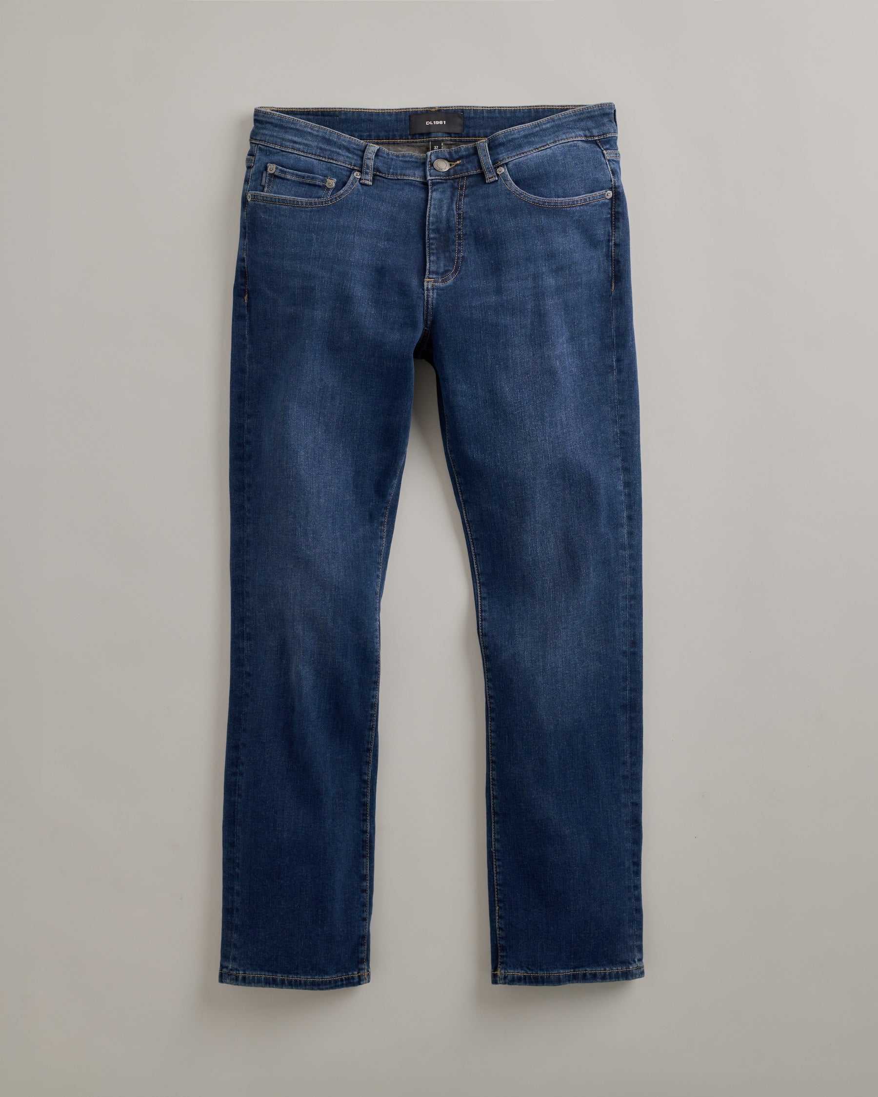 DL1961 men's Russell Slim Straight Jeans in 'Reader' — studio flat lay packshot on a plain background, no model.